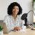 smiling-woman-recording-podcast-in-her-home-studio-2026-03-25-09-24-38-utc-1.jpg